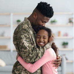 Soldier hugging a child